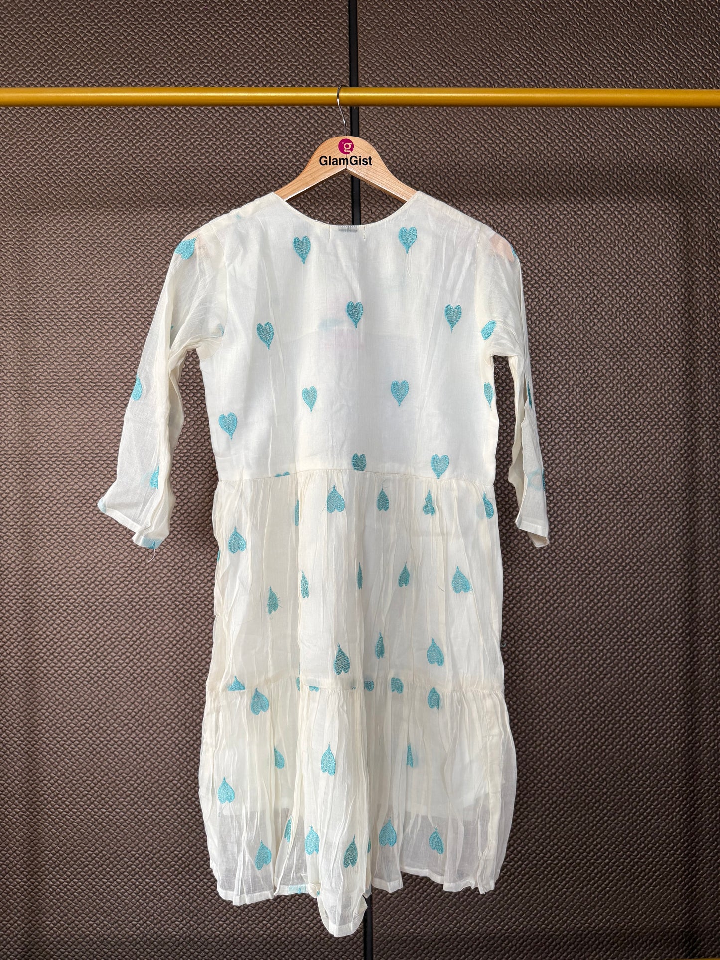 Ivory tunic with teal hearts embroidery