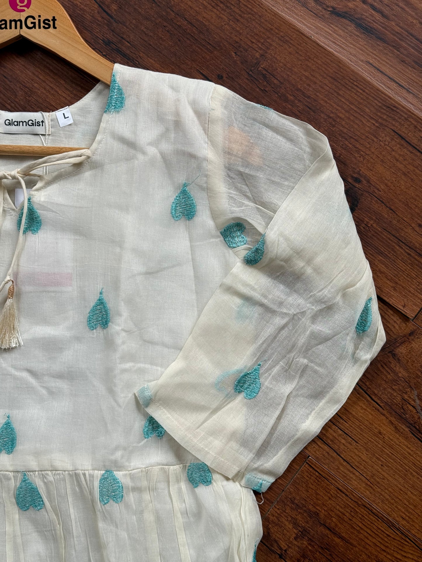 Ivory tunic with teal hearts embroidery