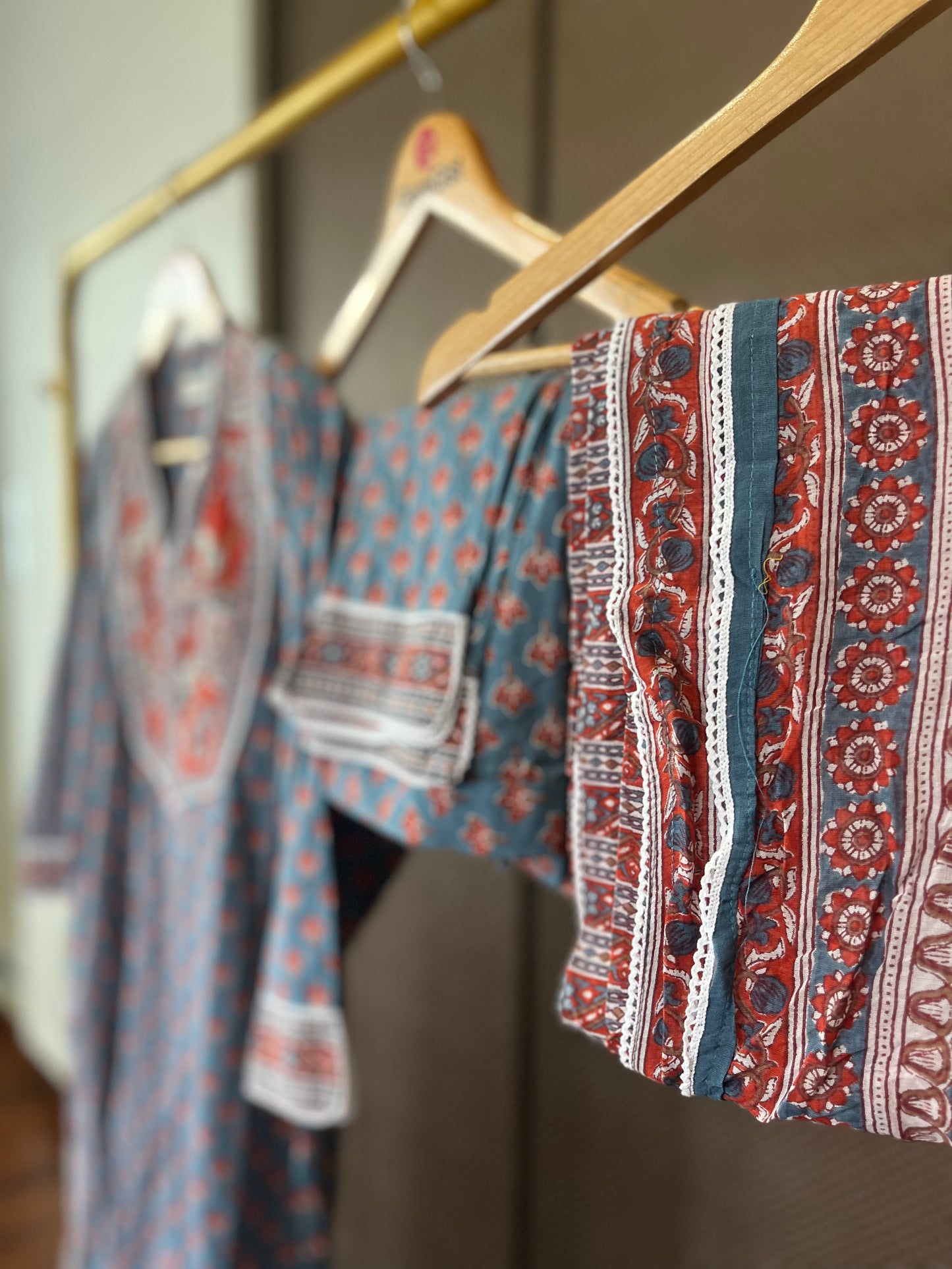 Blue kurti set with red and white accents