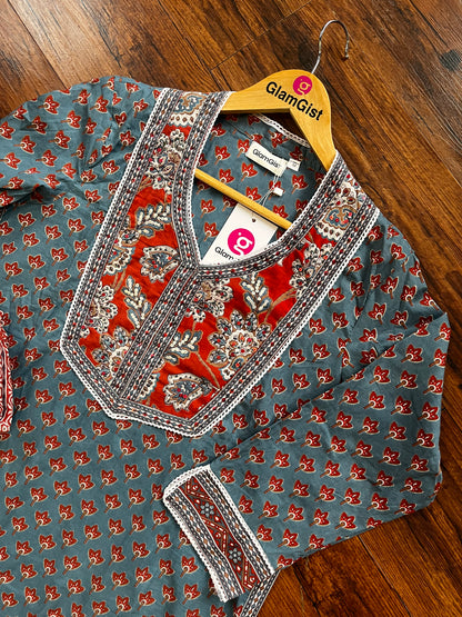Blue kurti set with red and white accents